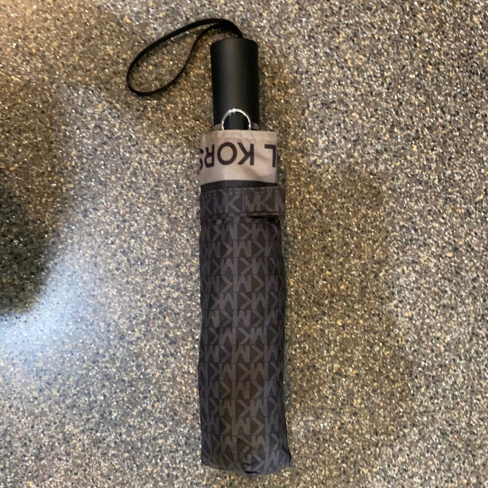 Michael Kors black signature umbrella.
